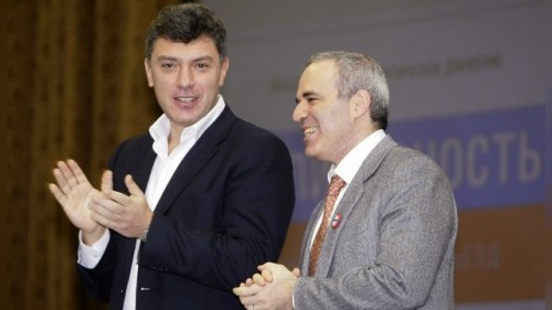 Opposition leaders Nemtsov and Kasparov applaud during the inauguration congress of the anti-Kremlin "Solidarity" movement in Moscow
