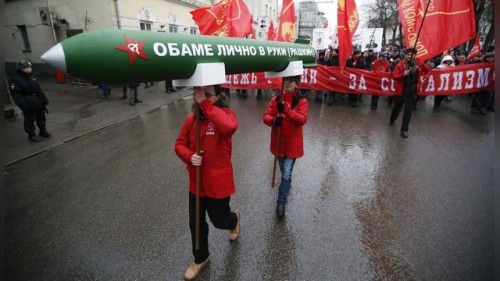 Supporters and activists of the Russian Communist party take part in a procession to mark the Defender of the Fatherland Day in central Moscow