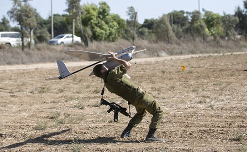 An Israeli soldier launches a Skylark unmanned aerial vehicle near the Israeli-Gaza Border
