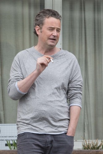 EXCLUSIVE: Where are your Friends? Matthew Perry appears to be talking to himself while having a cigarette break in London.